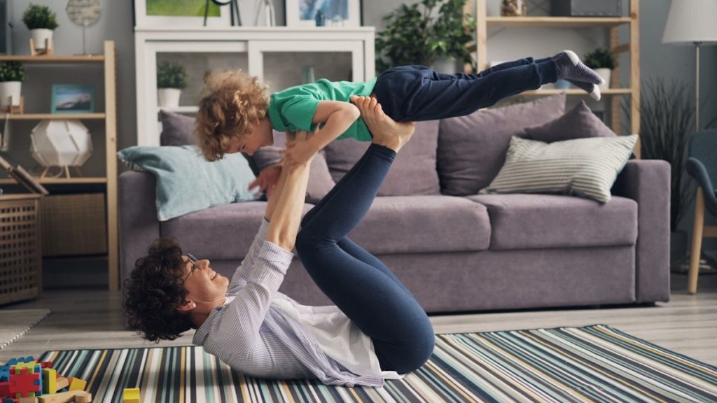 a woman and a child playing on the floor